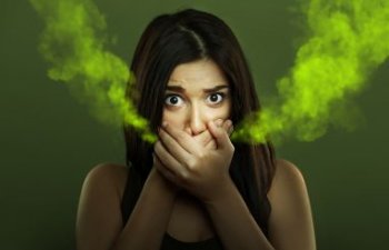 woman suffering from halitosis