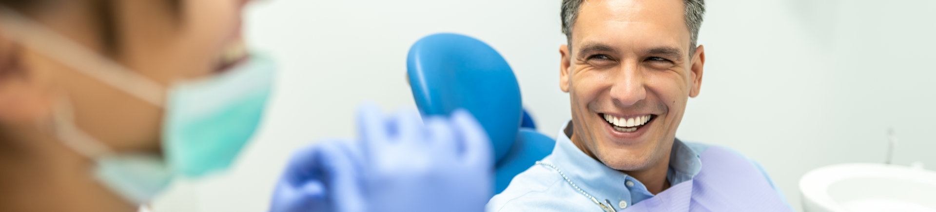 patient sitting in dentist chair