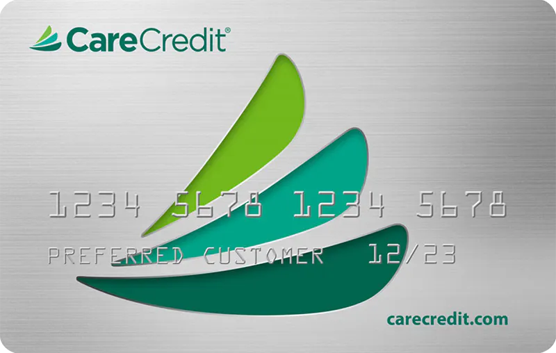 A CareCredit card displaying a series of green logos, card number, and "PREFERRED CUSTOMER" label with an expiration date of 12/23. Web address carecredit.com is shown below.