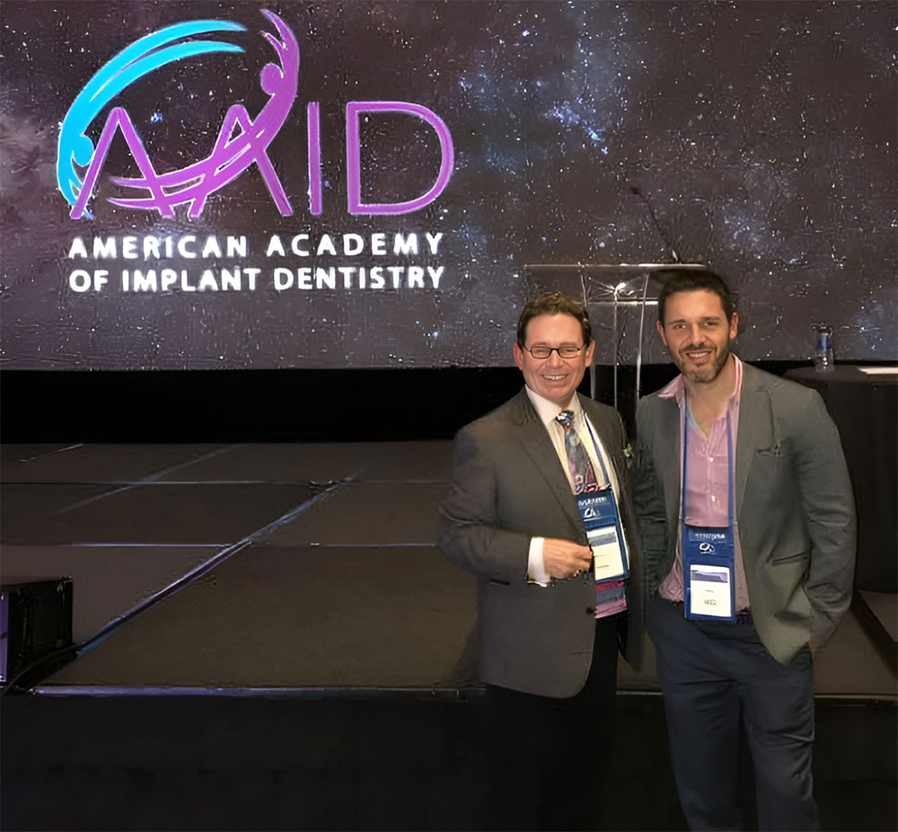 Dr. Scott and his father attending the 67th Annual American Academy of Implant Dentistry conference in Dallas, Texas