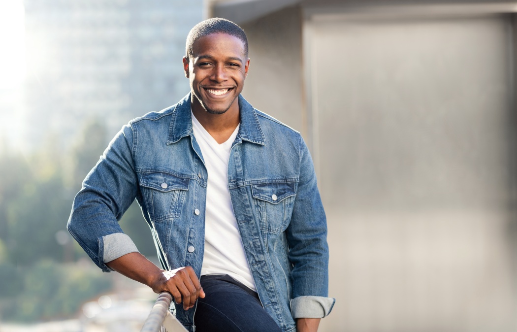 Casual lifestyle portrait of an african american male with perfect white teeth smile, commercial model
