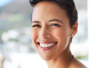 Outdoor, dental or portrait of happy woman with confidence, teeth whitening or oral care for healthy veneers. Dentist, smile or face of orthodontist laughing with beauty, tooth implant or clean mouth